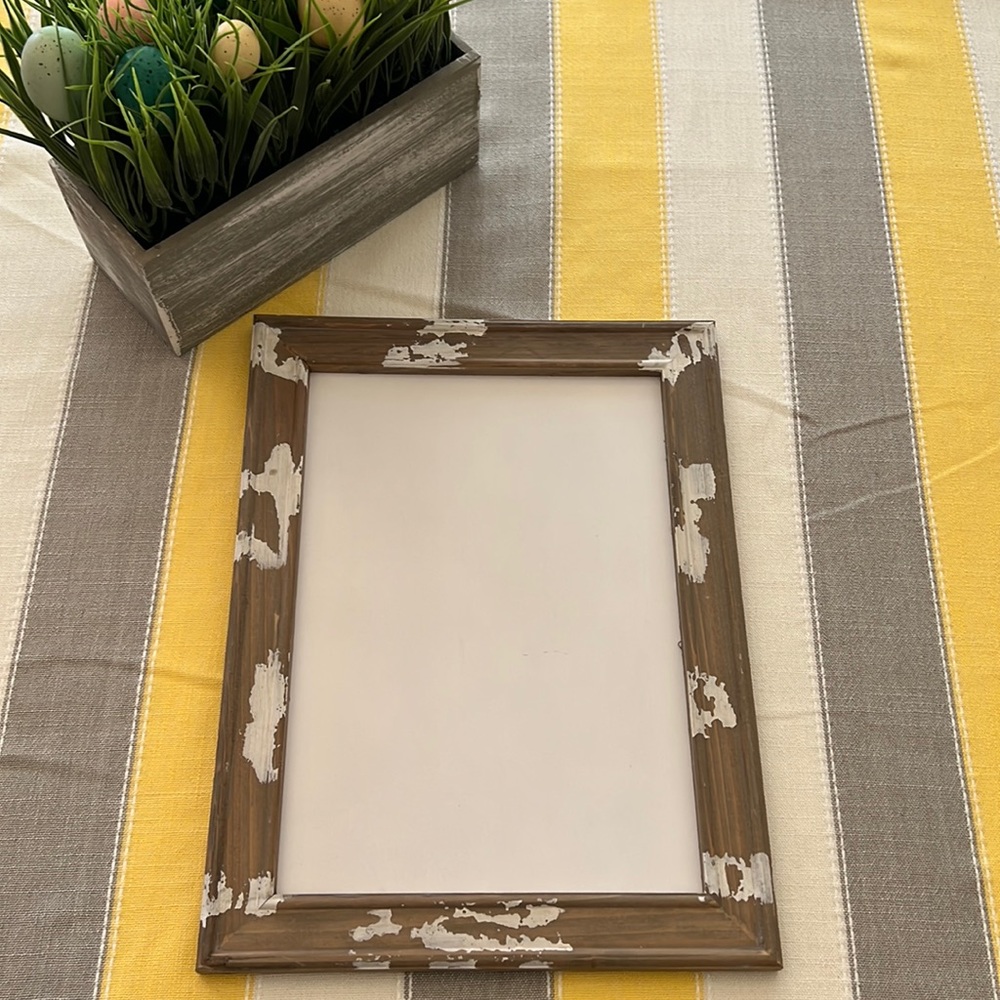 White sign with distressed frame